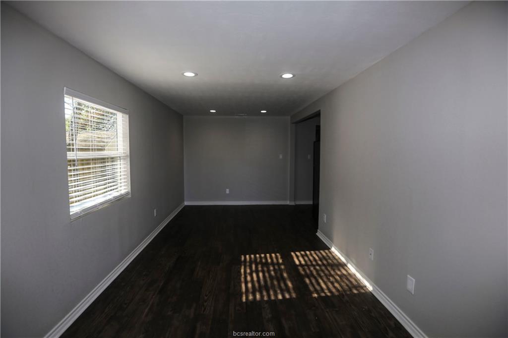 814 Mitchell Street Bryan, TX 77802 - Photo 2 of 14 a view of an empty room with a window