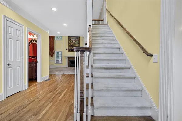 a view of entryway and hall with wooden floor