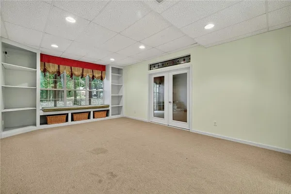 a view of an empty room with a window