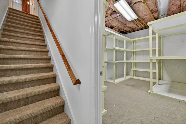 a view of an empty room with stairs