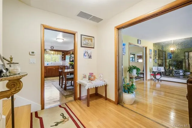 a view of a livingroom with dining room and furniture