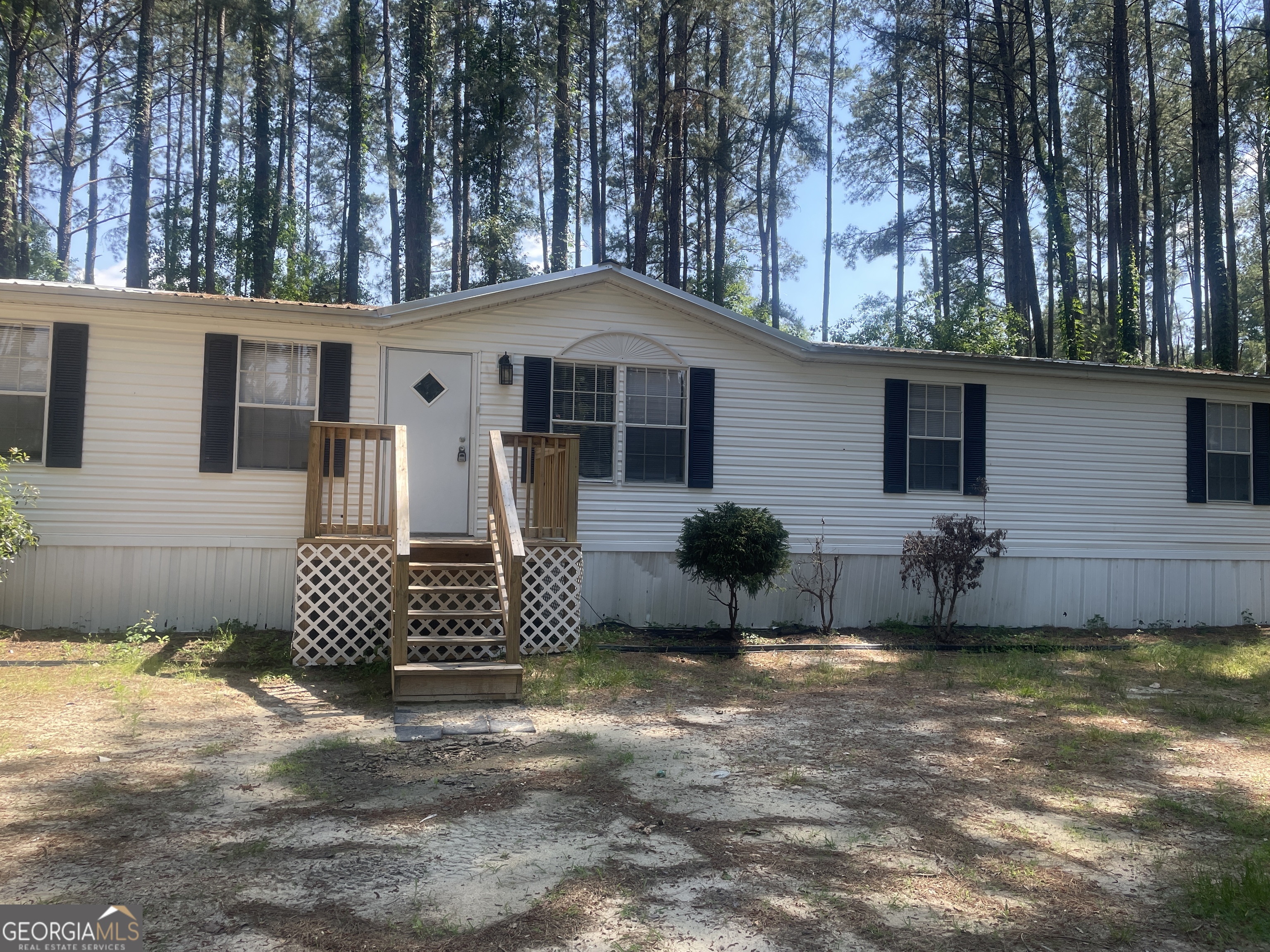 1714 Brook Run Register, GA 30452 - Photo 1 of 1 a front view of a house with a yard