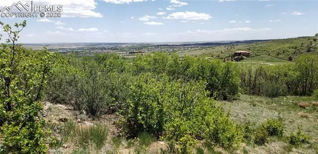 a view of a field with an outdoor space