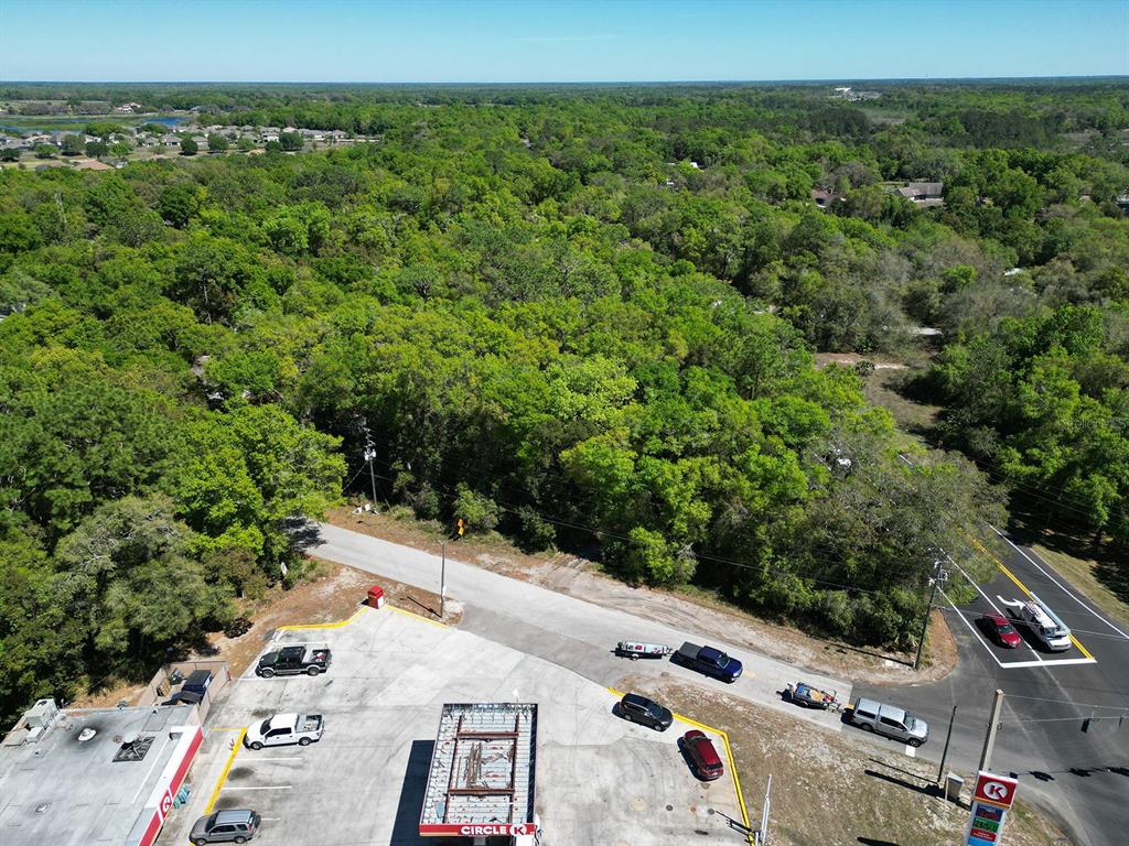 Niles St Mount Sorrento, FL 32776 - Photo 3 of 13 an aerial view of multiple houses with yard