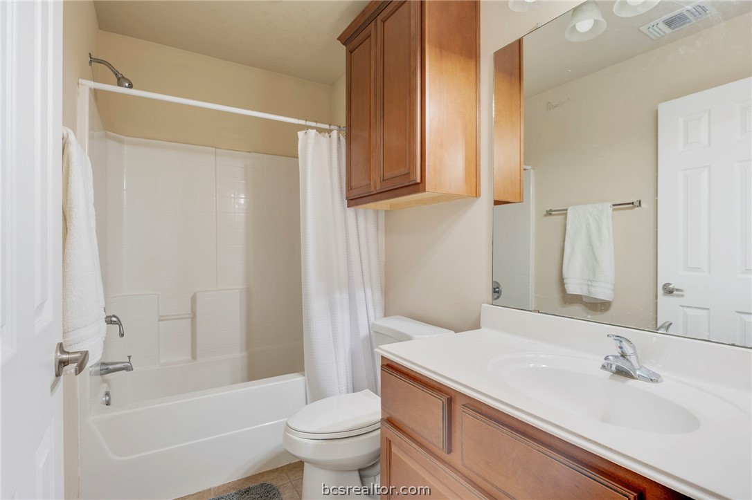 1198 Jones-Butler Road, Unit 1002 College Station, TX 77840 - Photo 11 of 18 a bathroom with a sink a toilet and shower