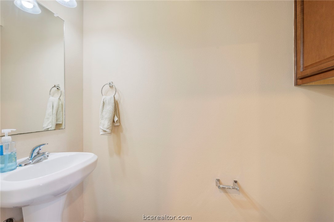 1198 Jones-Butler Road, Unit 1002 College Station, TX 77840 - Photo 14 of 18 a bathroom with a sink and a mirror