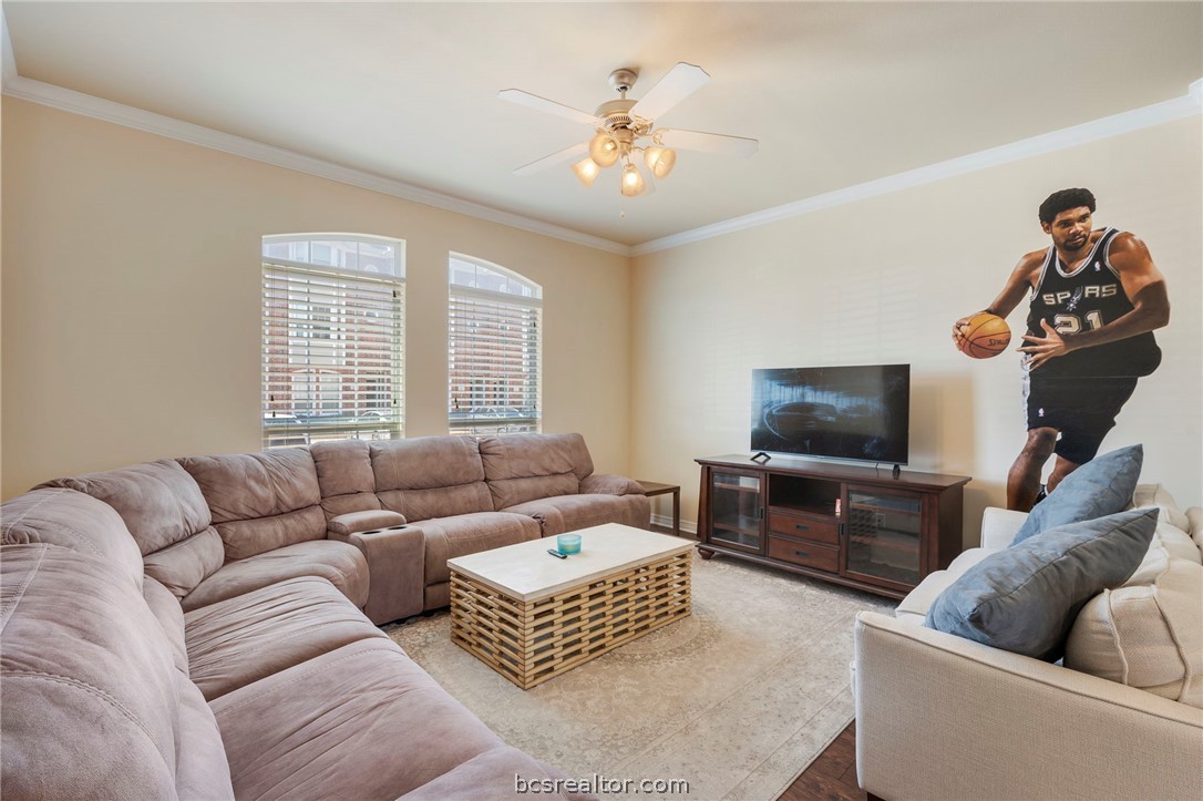 1198 Jones-Butler Road, Unit 1002 College Station, TX 77840 - Photo 3 of 18 a living room with furniture and a flat screen tv