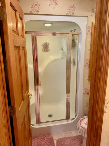 a bathroom with a sink toilet and mirror