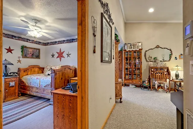 a bathroom with a sink mirror and a shower