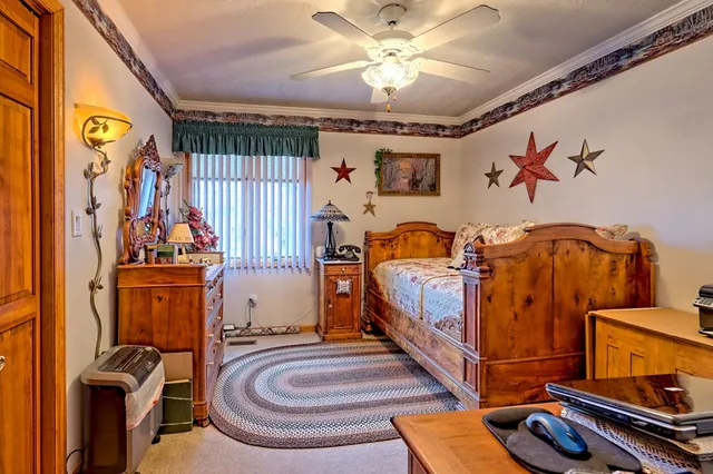 a bathroom with a granite countertop toilet sink and shower