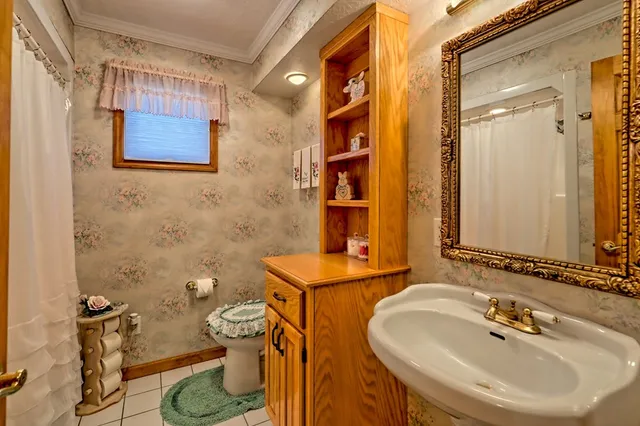 a view of a house with a yard covered in snow