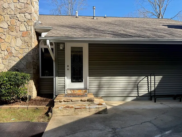 a kitchen with refrigerator and cabinets