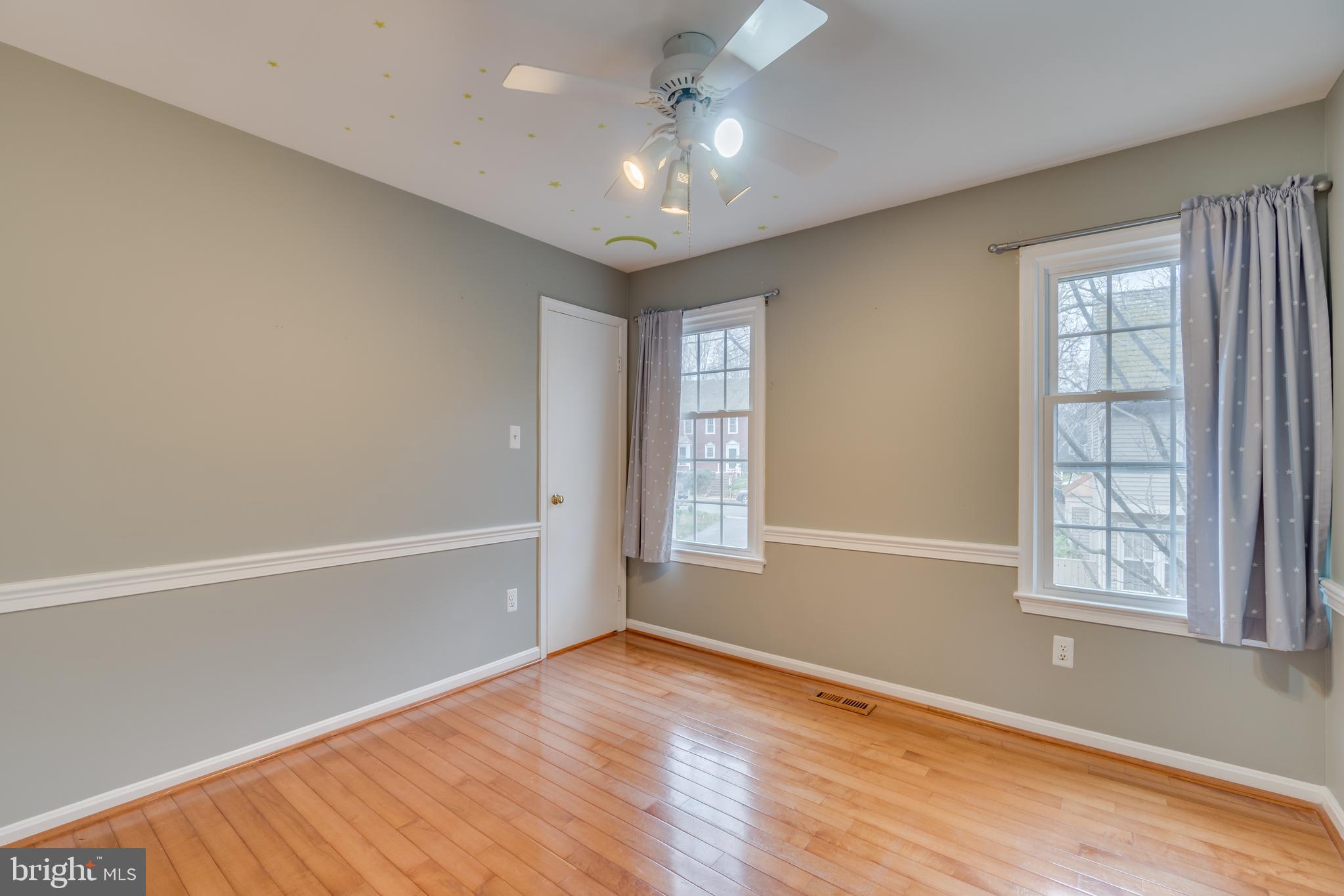 2069 Cobblestone Lane Reston, VA 20191 - Photo 18 of 35 wooden floor in an empty room with a window