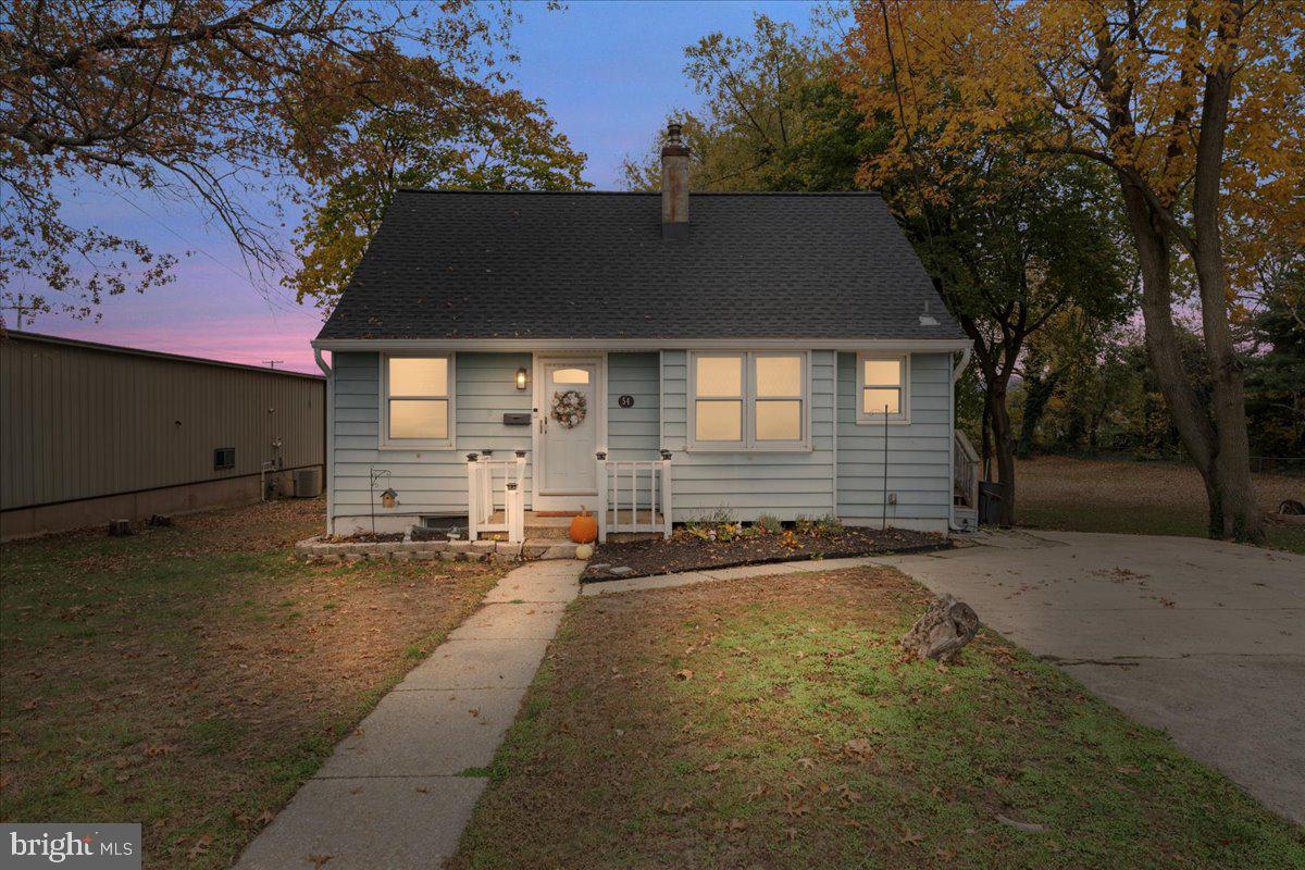 54 West Browning Road Bellmawr, NJ 08031 - Photo 1 of 25 a front view of a house with a yard