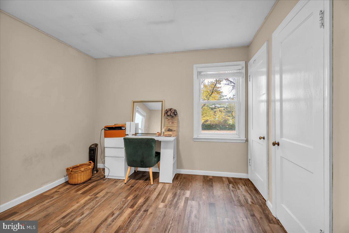 54 West Browning Road Bellmawr, NJ 08031 - Photo 12 of 25 a room with furniture and a window