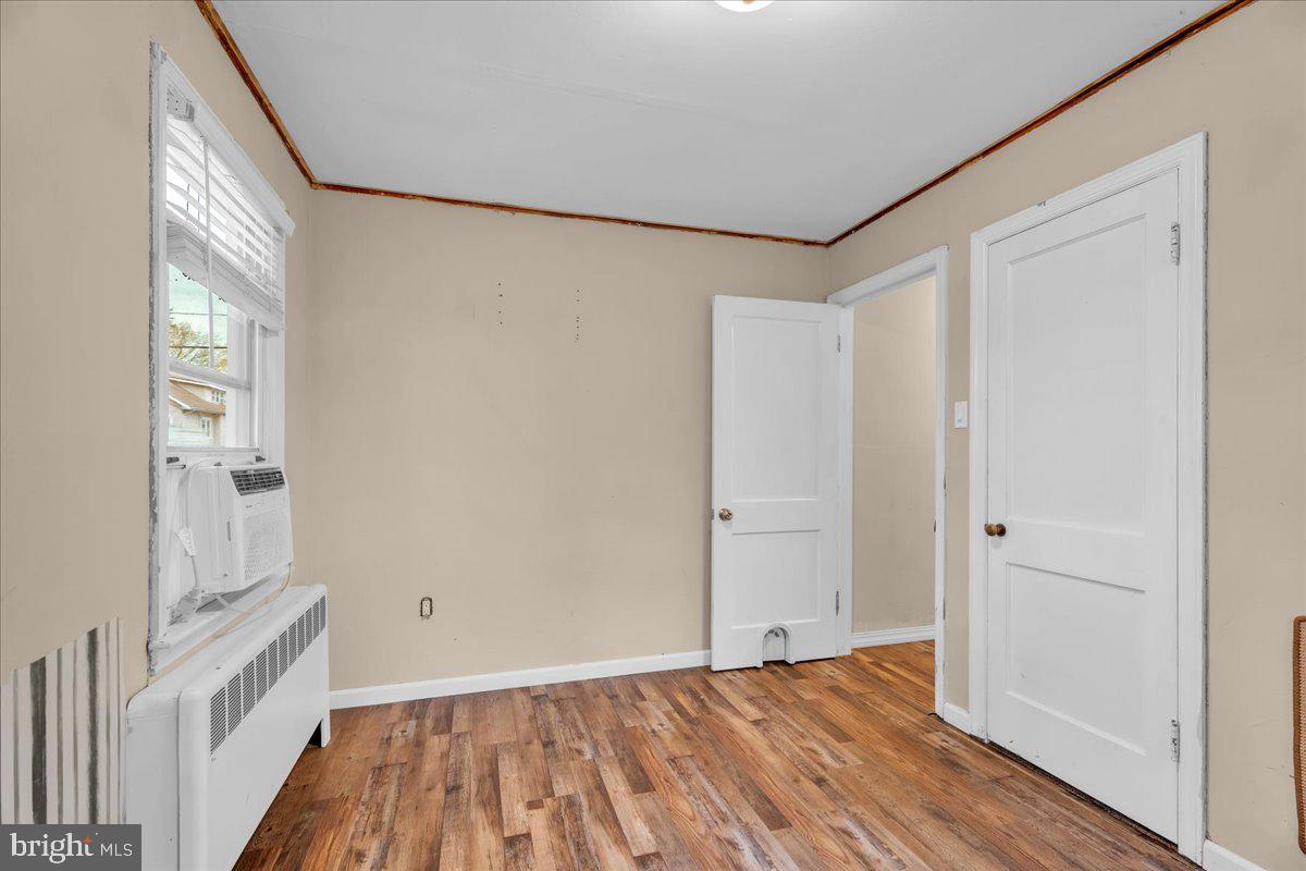 54 West Browning Road Bellmawr, NJ 08031 - Photo 15 of 25 a view of a room with wooden floor and small window