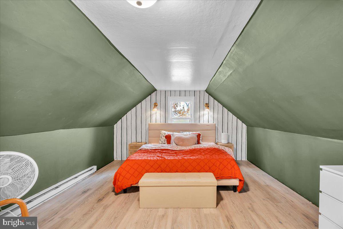 54 West Browning Road Bellmawr, NJ 08031 - Photo 20 of 25 a bed sitting in a bedroom next to a window