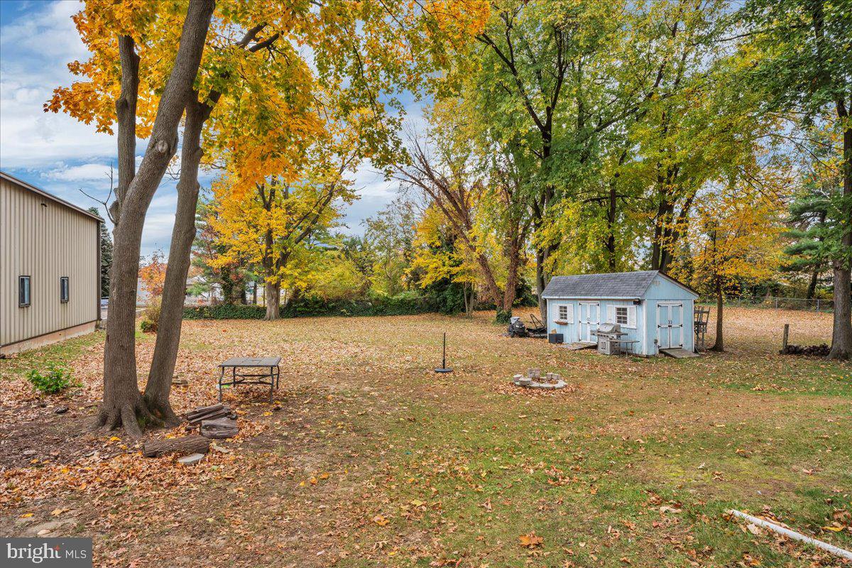 54 West Browning Road Bellmawr, NJ 08031 - Photo 24 of 25 a house with trees in front of it