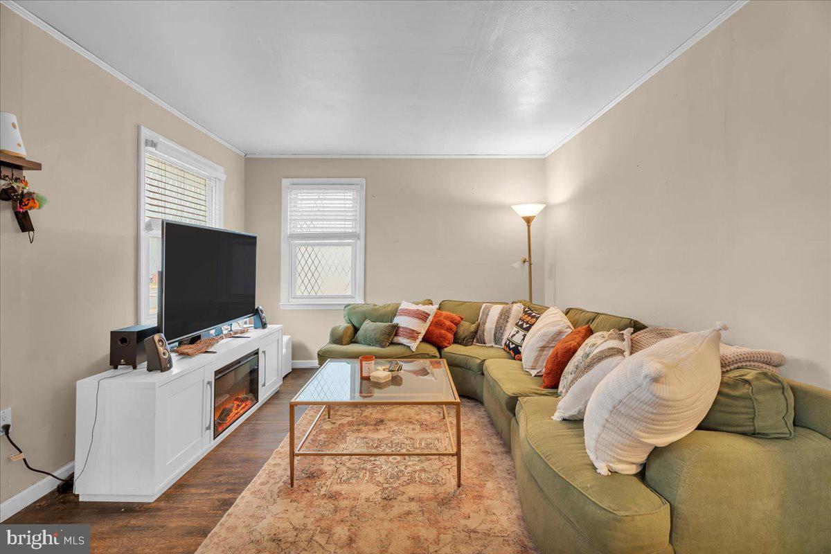 54 West Browning Road Bellmawr, NJ 08031 - Photo 6 of 25 a living room with furniture and a flat screen tv