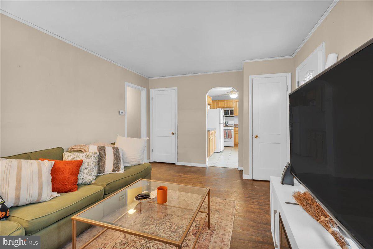 54 West Browning Road Bellmawr, NJ 08031 - Photo 7 of 25 a living room with furniture and a couch