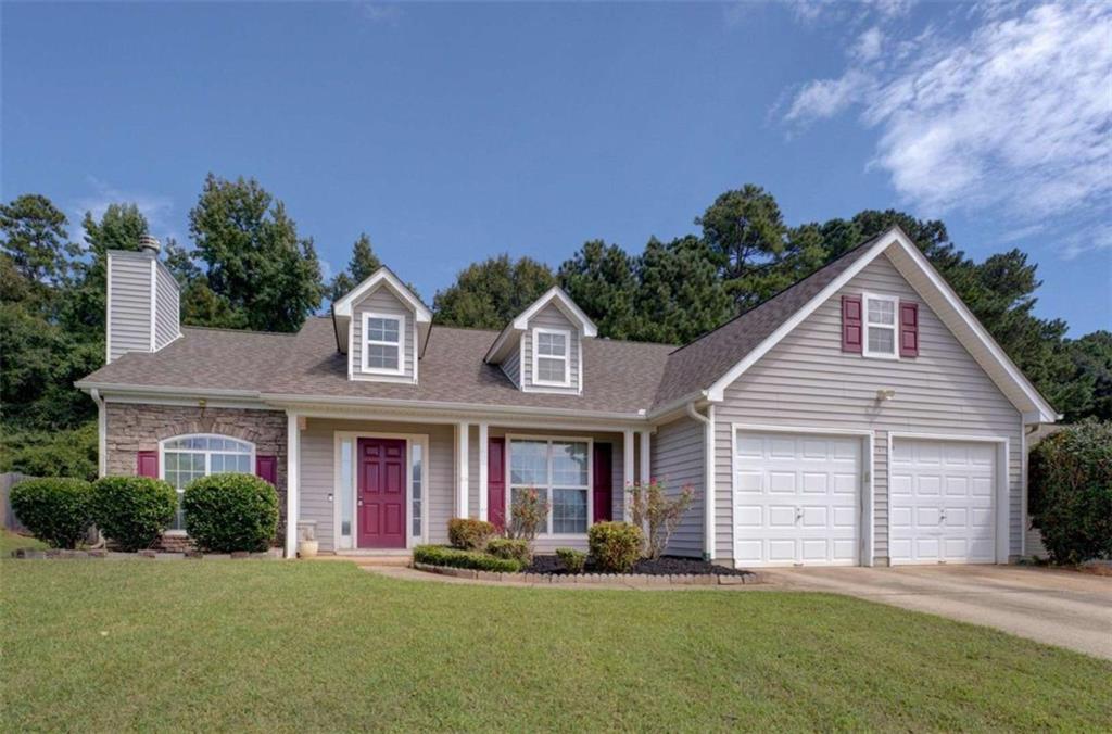 140 Ridge Pointe Drive Covington, GA 30016 - Photo 1 of 1 a front view of a house with a yard and garage