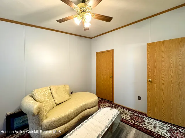 a bedroom with a bed and couch