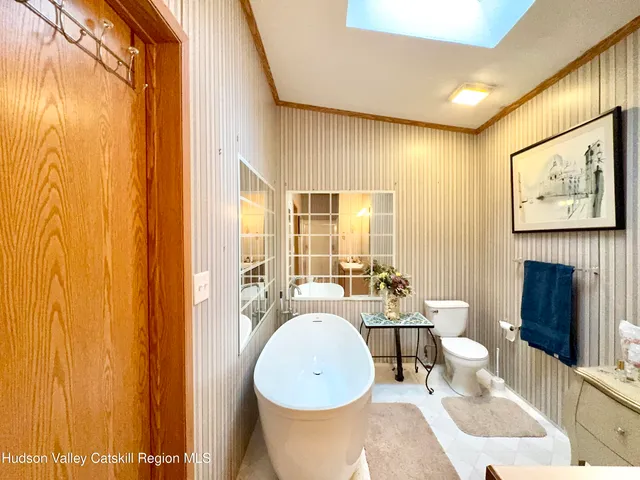 a living room with a table and chairs