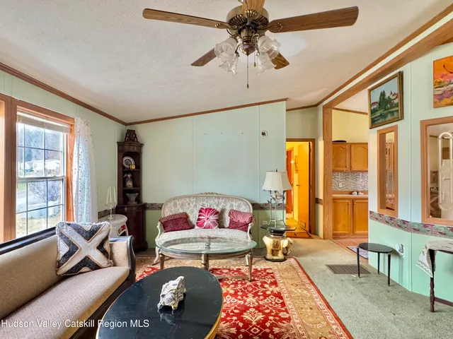 a living room with furniture and a table