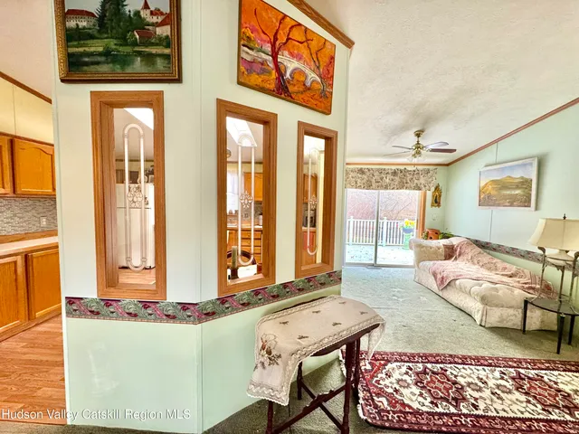 a living room with furniture and next to a window