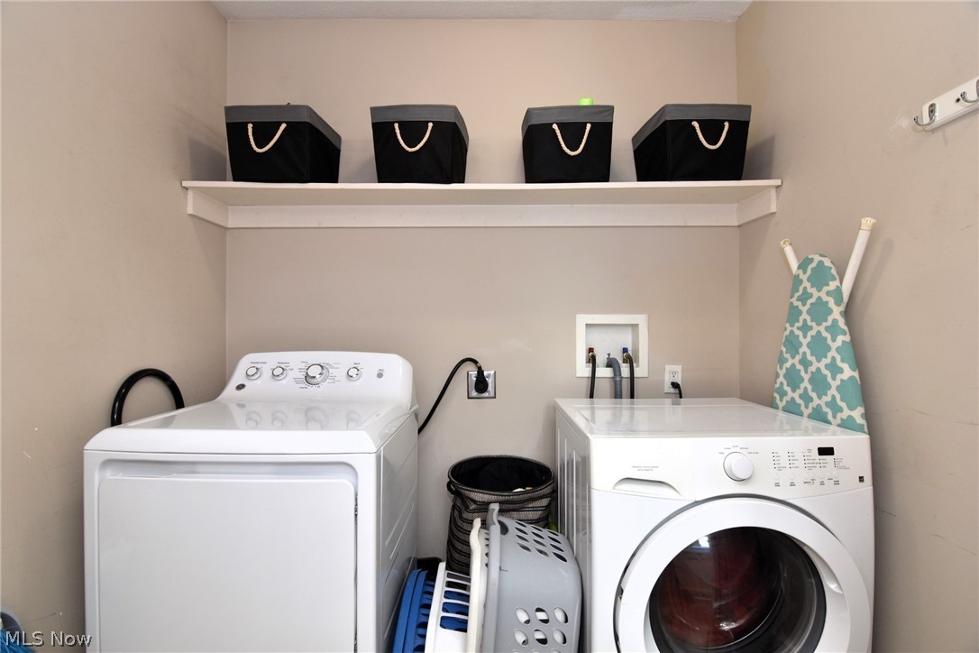 3584 Pennington Road Cleveland, OH 44120 - Photo 23 of 42 Laundry room featuring separate washer and dryer, hookup for a washing machine, and electric dryer hookup