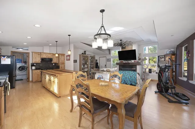 a kitchen with granite countertop a refrigerator stove and microwave