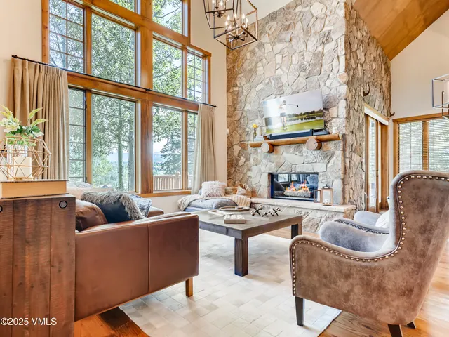 a living room with furniture and a table