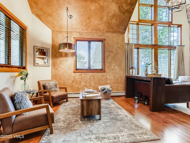 a bedroom with a large bed and a large window