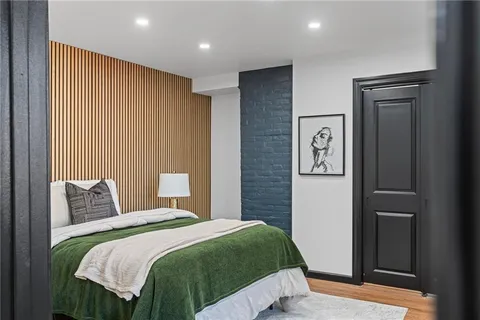 a bedroom with a large bed and a closet