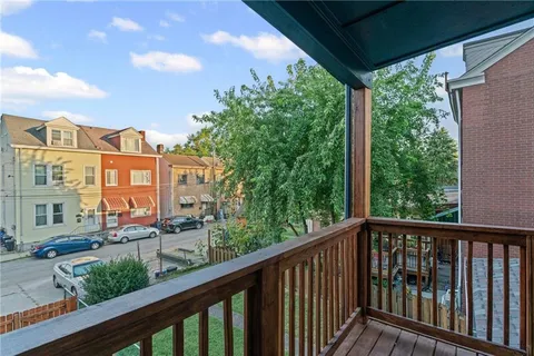 a view of a large building from a balcony