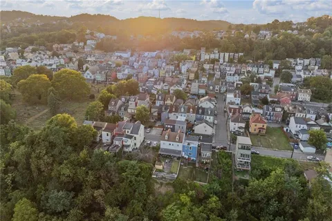 a view of a city with mountains in the background