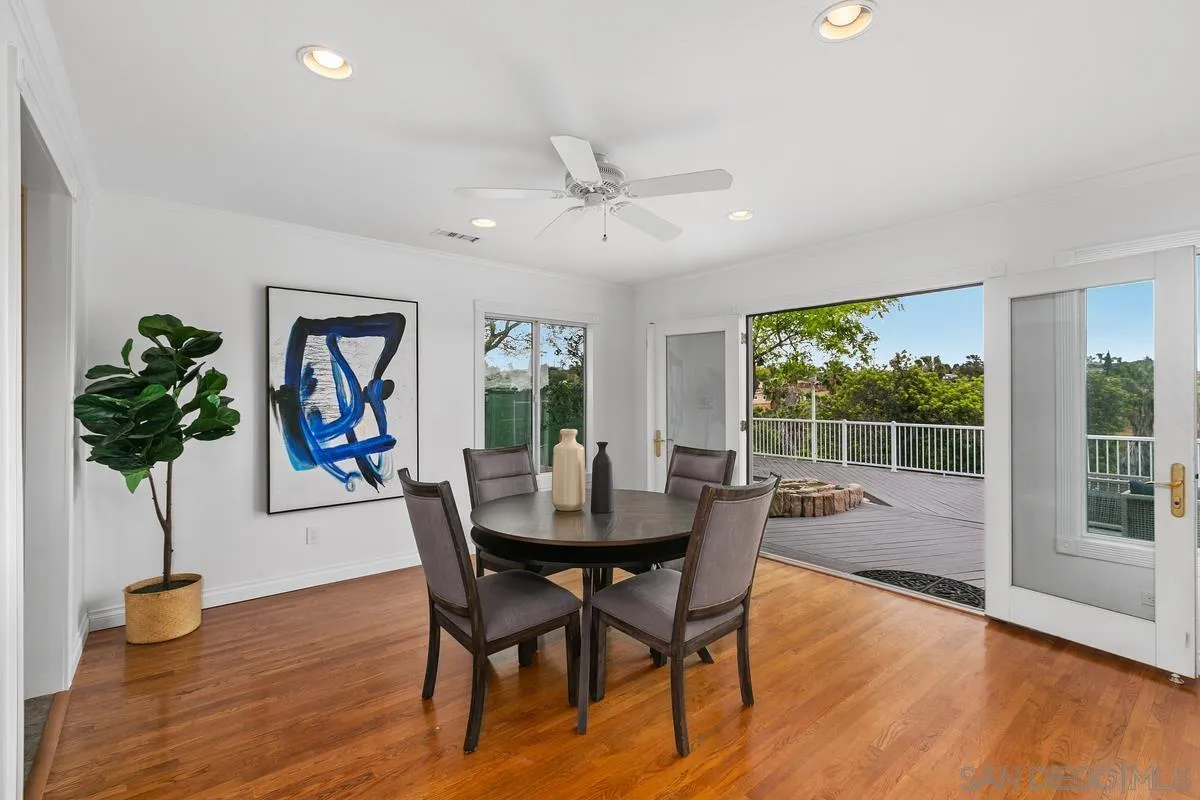 7609 El Paso Street La Mesa, CA 91942 - Photo 12 of 46 a view of a dining room with furniture window and wooden floor
