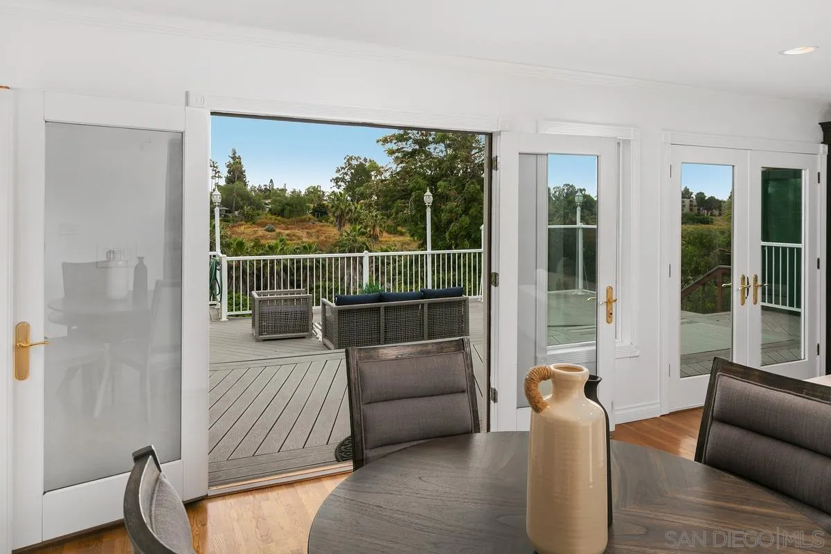 7609 El Paso Street La Mesa, CA 91942 - Photo 14 of 46 a living room with furniture and a floor to ceiling window