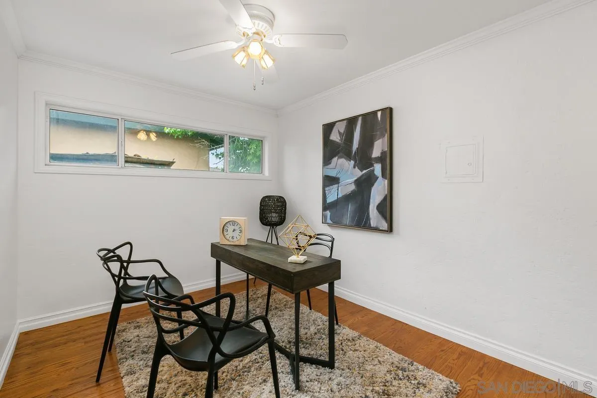 7609 El Paso Street La Mesa, CA 91942 - Photo 18 of 46 a view of a workspace with furniture and wooden floor