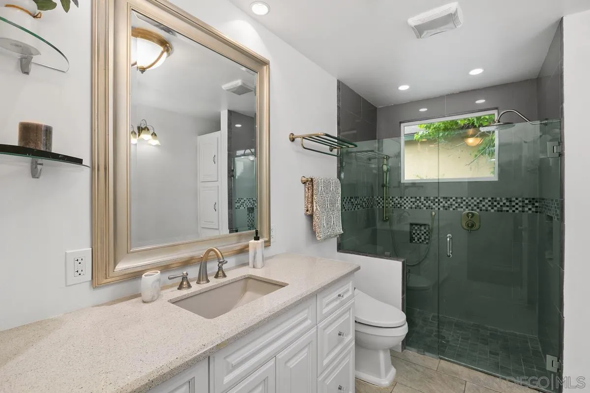7609 El Paso Street La Mesa, CA 91942 - Photo 19 of 46 a bathroom with a sink a toilet and shower