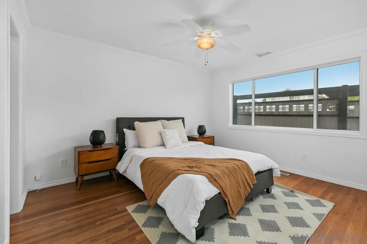 7609 El Paso Street La Mesa, CA 91942 - Photo 22 of 46 a bedroom with a bed and a window