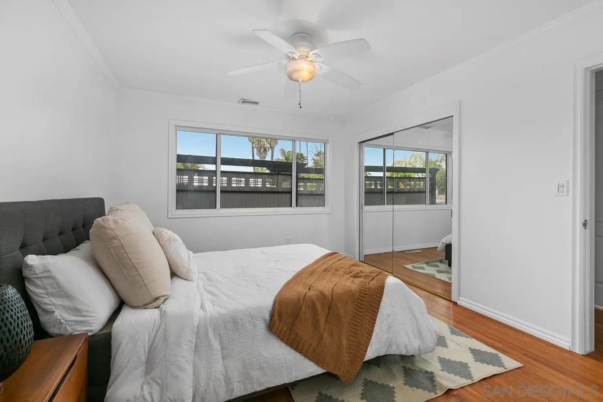 7609 El Paso Street La Mesa, CA 91942 - Photo 23 of 46 a bedroom with a bed and window