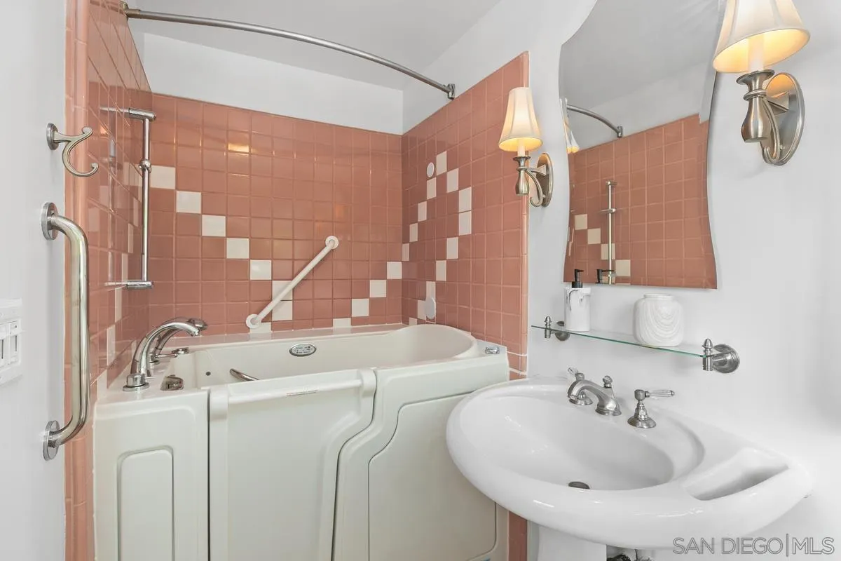 7609 El Paso Street La Mesa, CA 91942 - Photo 24 of 46 a bathroom with a sink and mirror