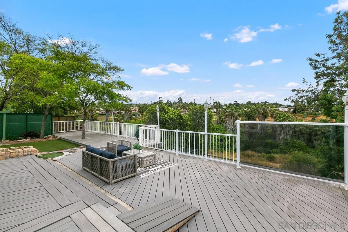 7609 El Paso Street La Mesa, CA 91942 - Photo 27 of 46 a view of a roof deck with couches and wooden floor