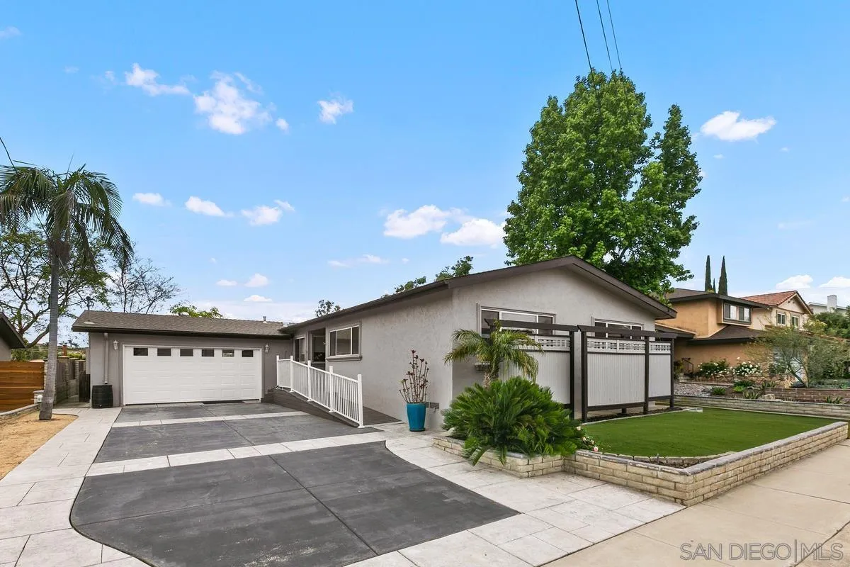 7609 El Paso Street La Mesa, CA 91942 - Photo 4 of 46 a front view of a house with garden