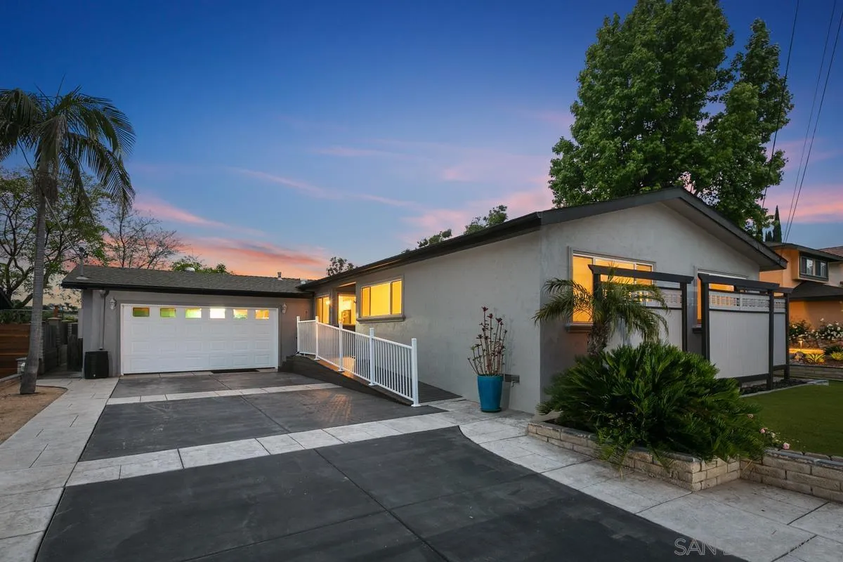 7609 El Paso Street La Mesa, CA 91942 - Photo 44 of 46 a front view of a house with a yard and garage