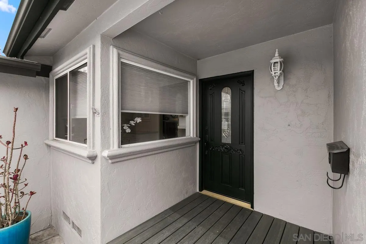 7609 El Paso Street La Mesa, CA 91942 - Photo 7 of 46 a view of a hallway with wooden floor and staircase