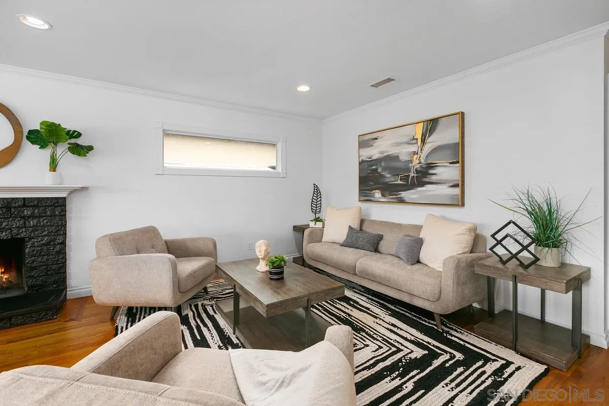 7609 El Paso Street La Mesa, CA 91942 - Photo 9 of 46 a living room with furniture and a fireplace
