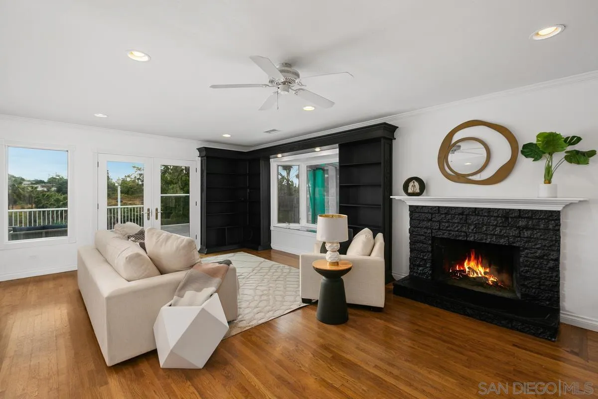 7609 El Paso Street La Mesa, CA 91942 - Photo 10 of 46 a living room with furniture and a fireplace