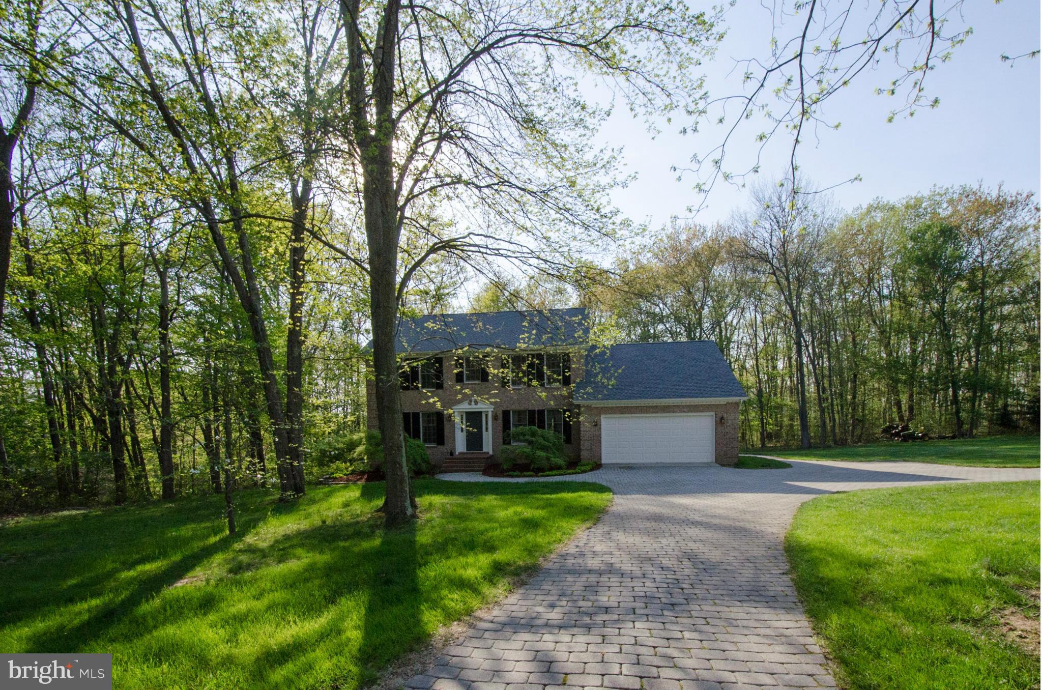 Gracious circular drive; great level play yard